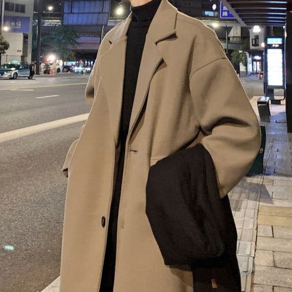 Long belted overcoat with notched lapels and side pockets