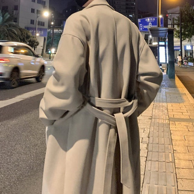 Long belted overcoat with notched lapels and side pockets