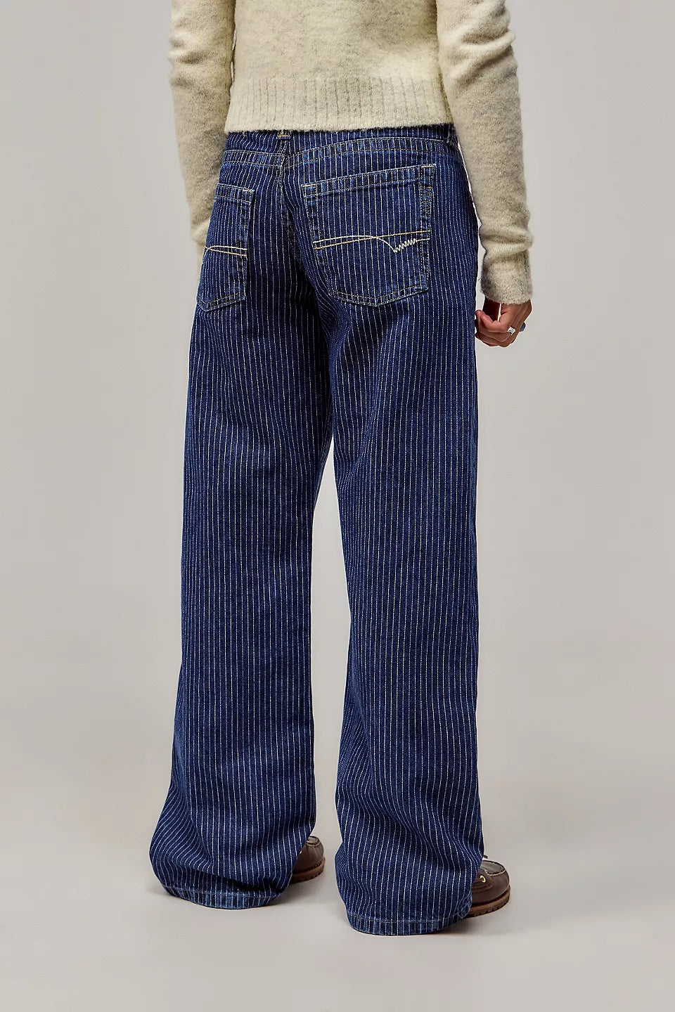 Women's wide-leg pinstripe jeans with mid-rise waist and front pockets