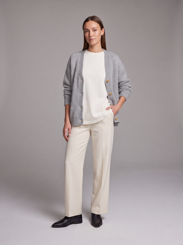 Women's grey oversized knit cardigan with buttons and long sleeves