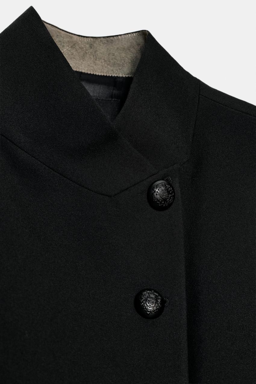 Women's structured blazer with mandarin collar, button front, long sleeves and welt pockets