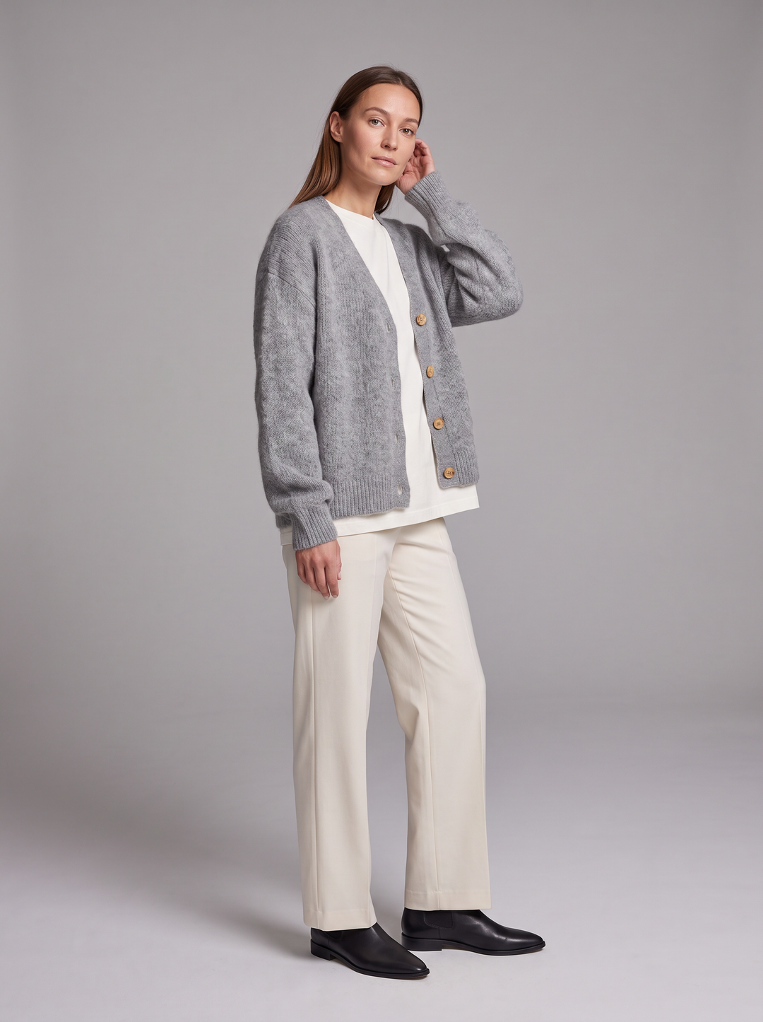 Women's grey oversized knit cardigan with buttons and long sleeves