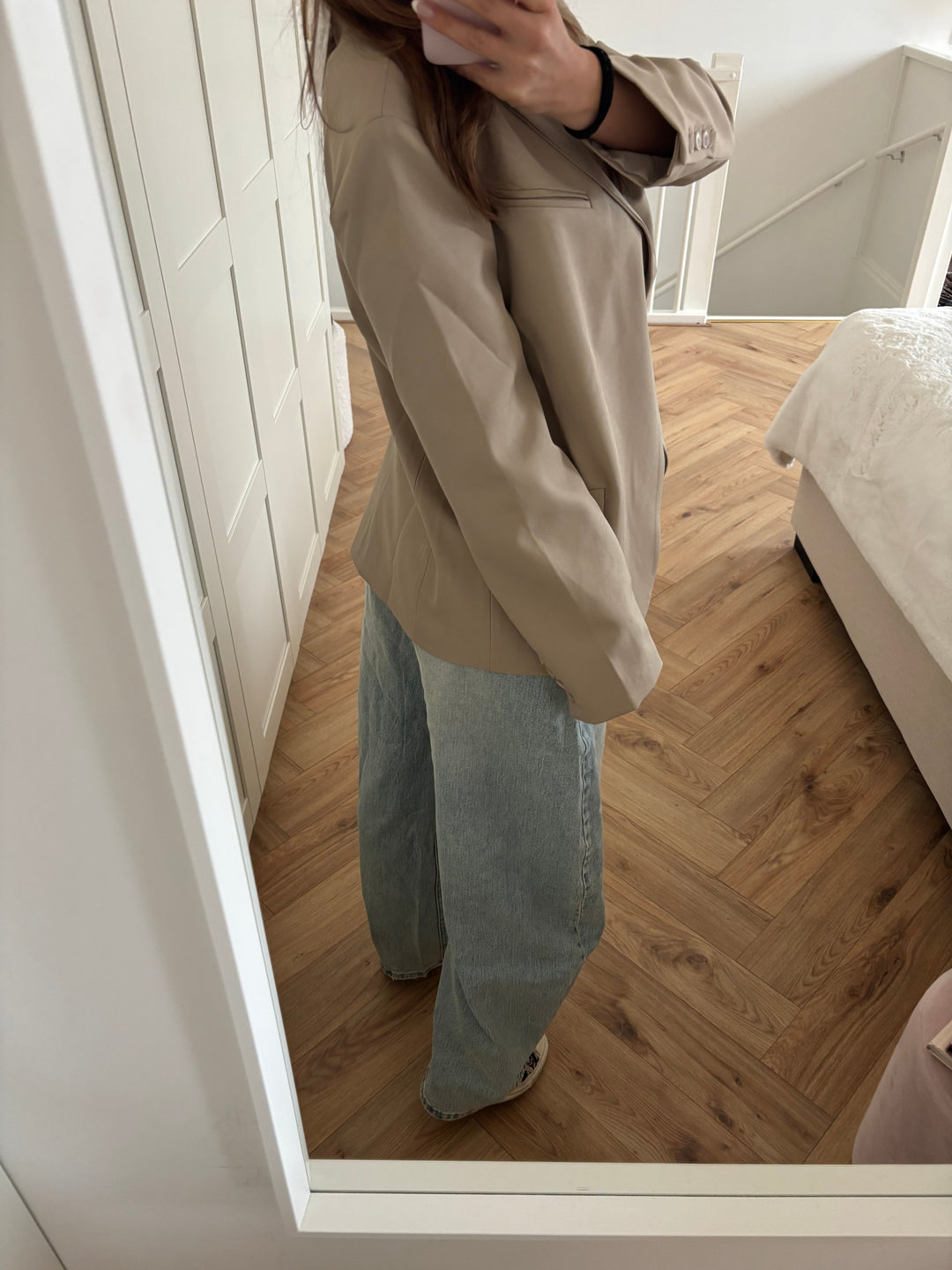 Women's beige blazer with high collar, long sleeves and button front