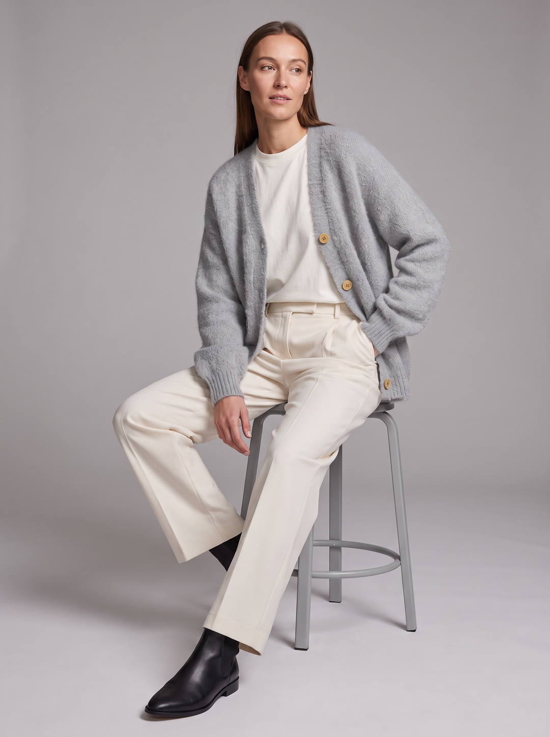 Women's grey oversized knit cardigan with buttons and long sleeves