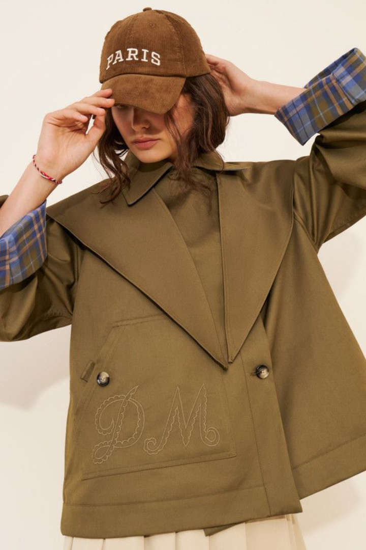 Women's brown jacket with blue plaid trim, raised collar and button front