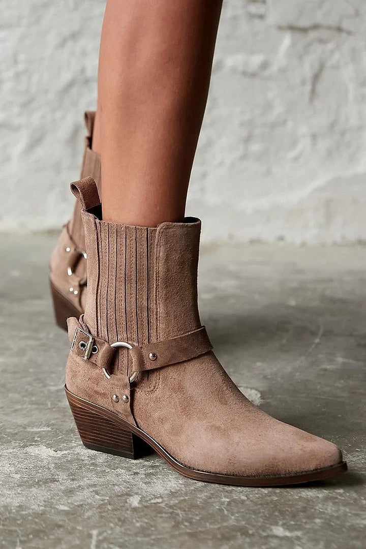 Brown women's western ankle boots with pointed toes, buckle straps and chunky block heels