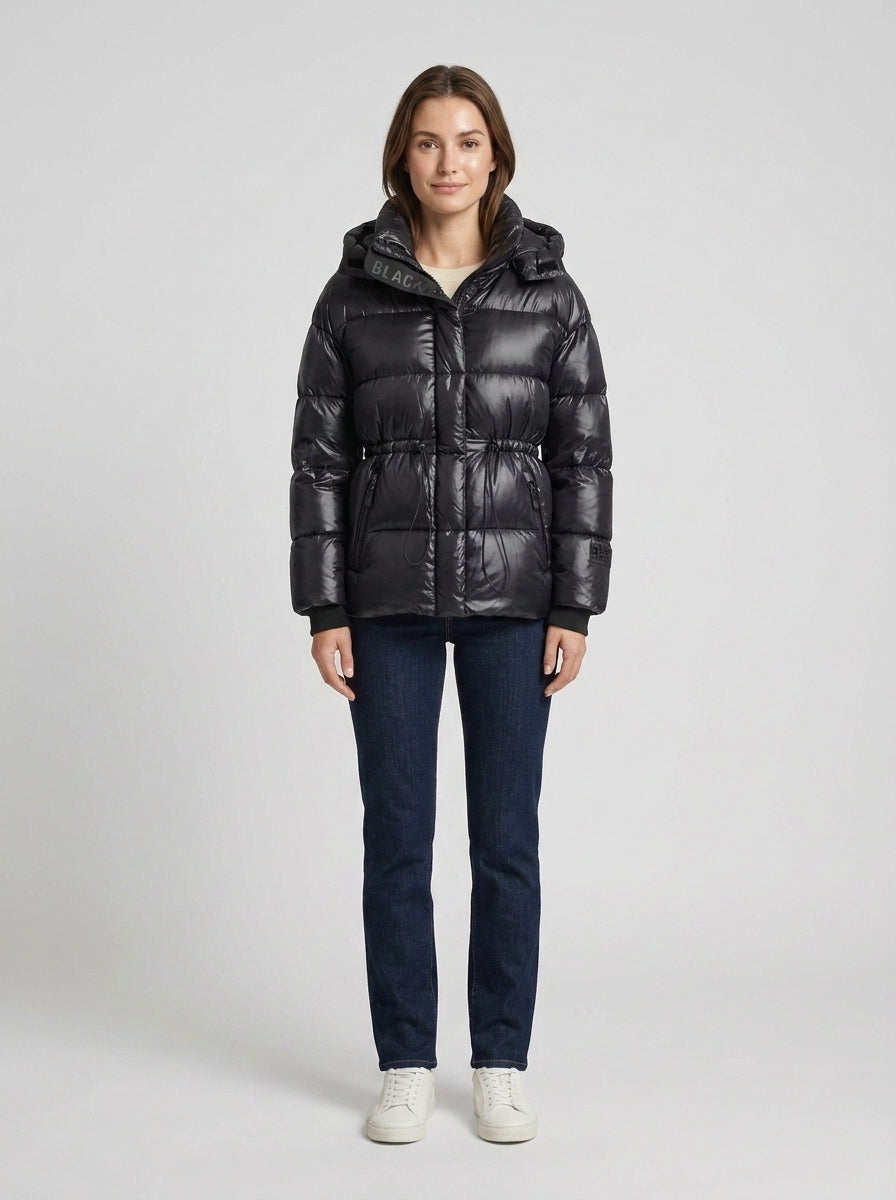 Women's black quilted hooded puffer jacket with adjustable waist and zip pockets