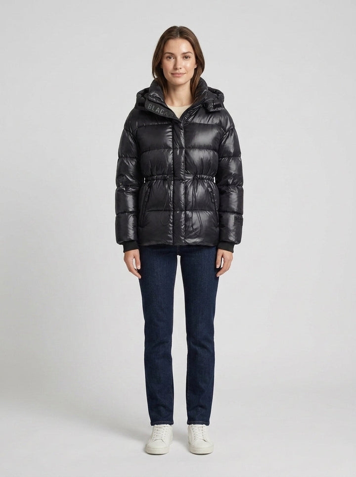 Women's black quilted hooded puffer jacket with adjustable waist and zip pockets