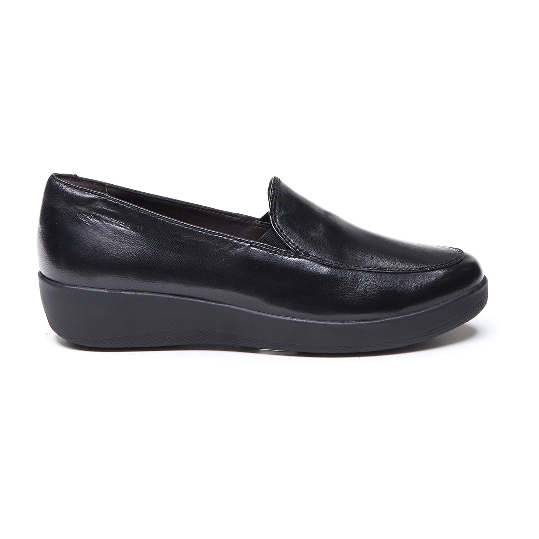 Women's black slip-on loafer with rounded toe and low wedge sole