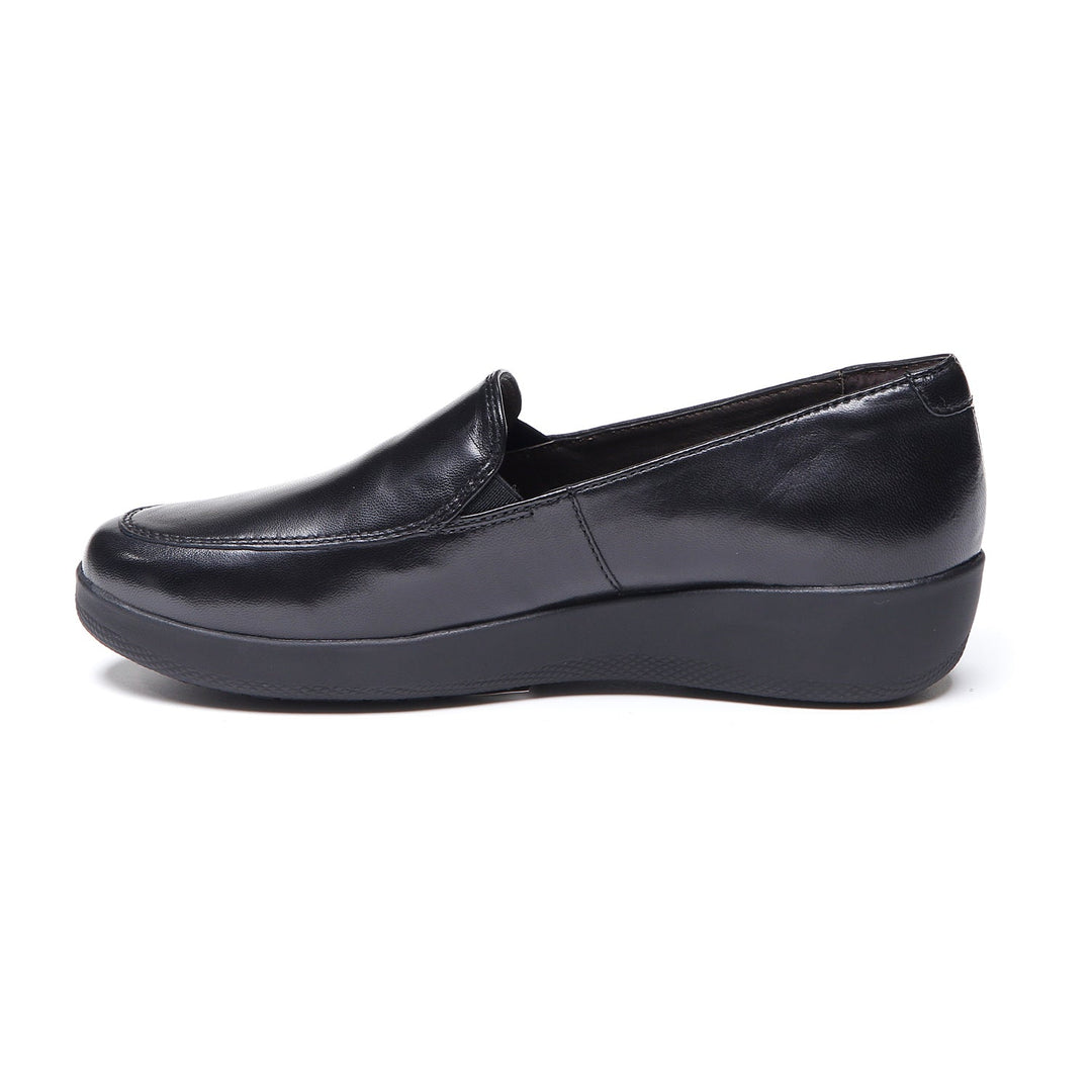 Women's black slip-on loafer with rounded toe and low wedge sole