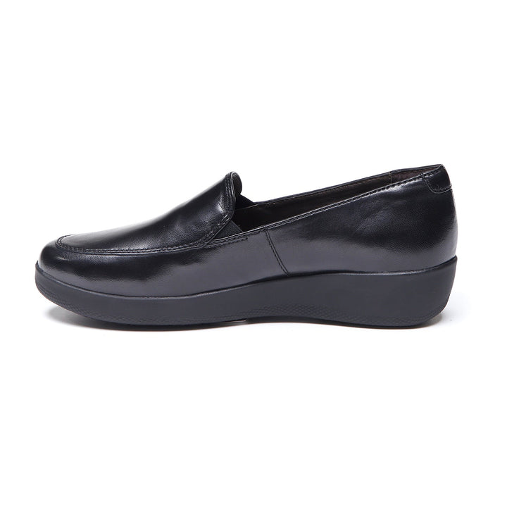 Women's black slip-on loafer with rounded toe and low wedge sole