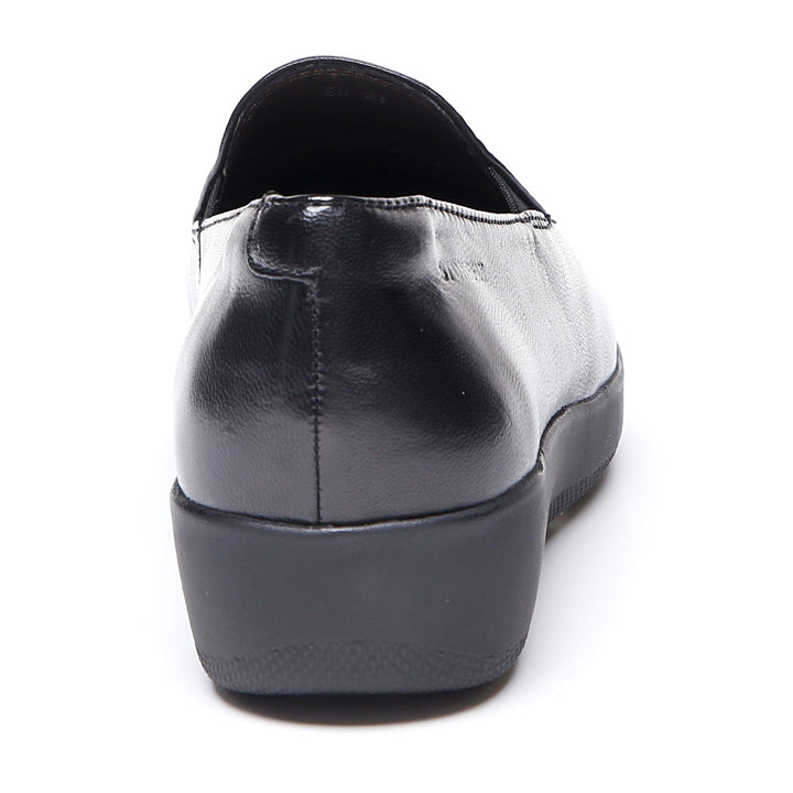 Women's black slip-on loafer with rounded toe and low wedge sole