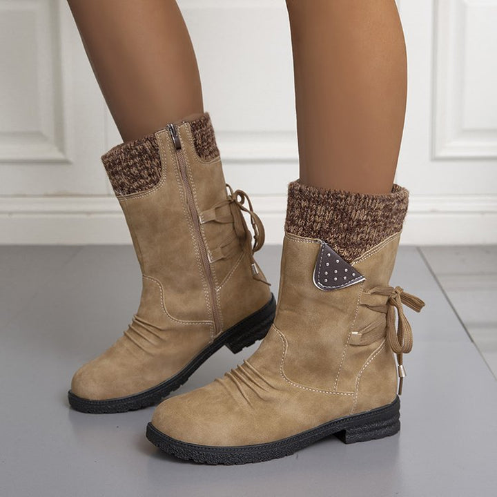 Women's winter boots with knitted cuffs, side zippers and lace-up details