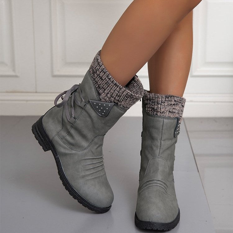 Women's winter boots with knitted cuffs, side zippers and lace-up details