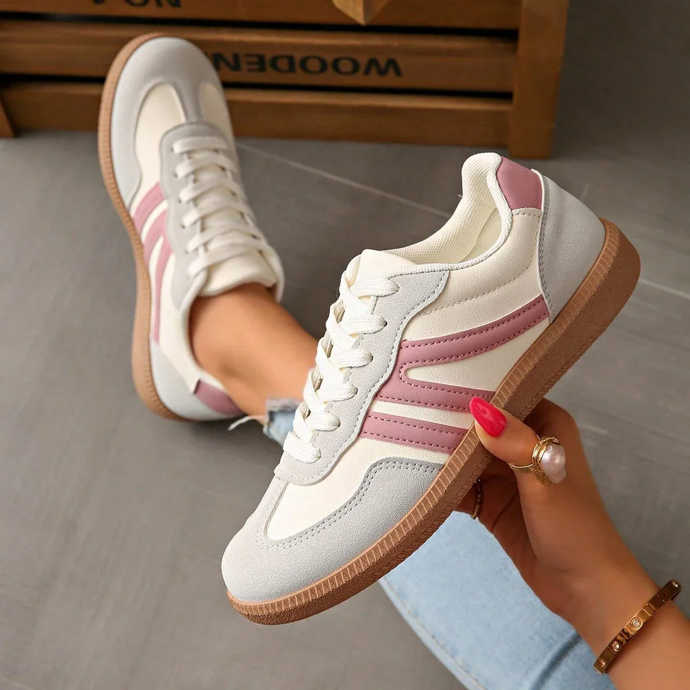 Women's white and pink low-top lace-up sneakers with round toes and gum-colour soles