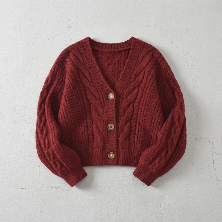 Women's cropped cable knit cardigan with V-neck and button front