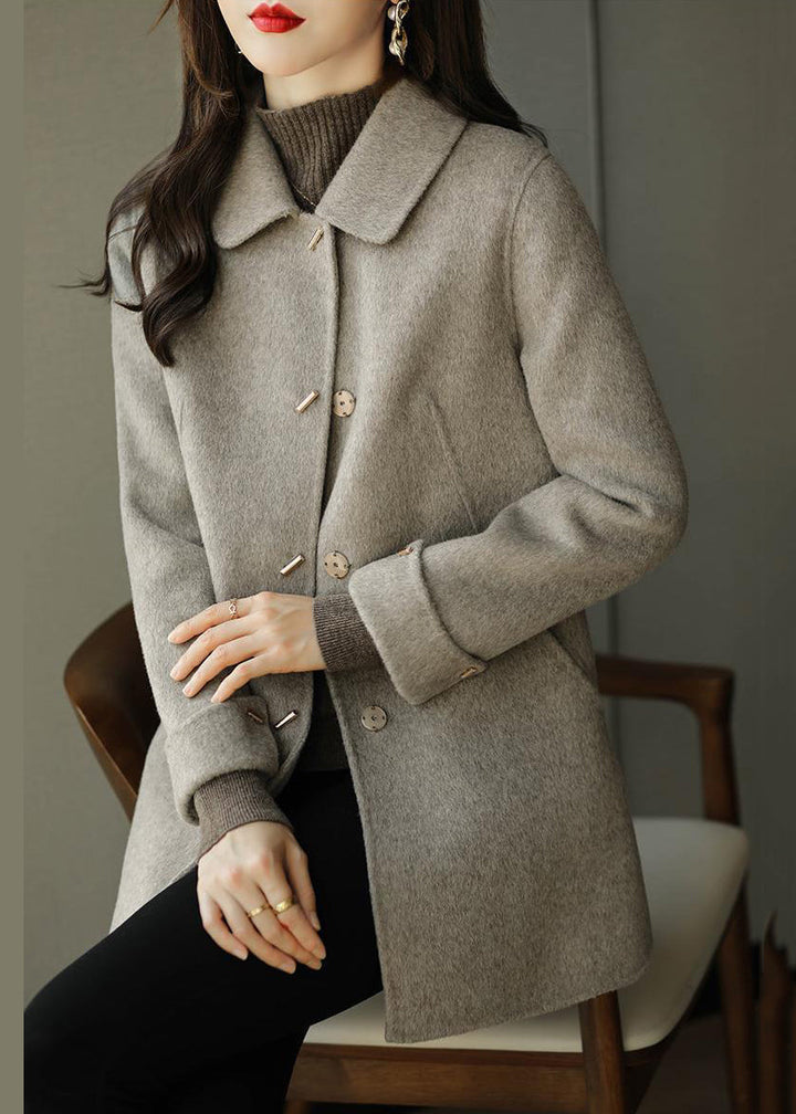 Women's beige button front coat with spread collar and long sleeves