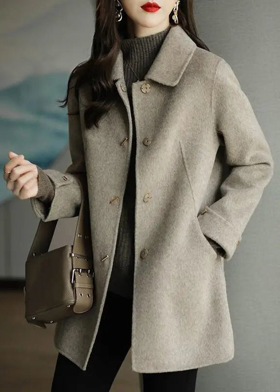 Women's beige button front coat with spread collar and long sleeves