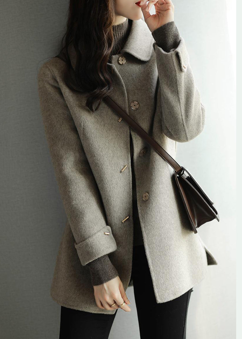 Women's beige button front coat with spread collar and long sleeves
