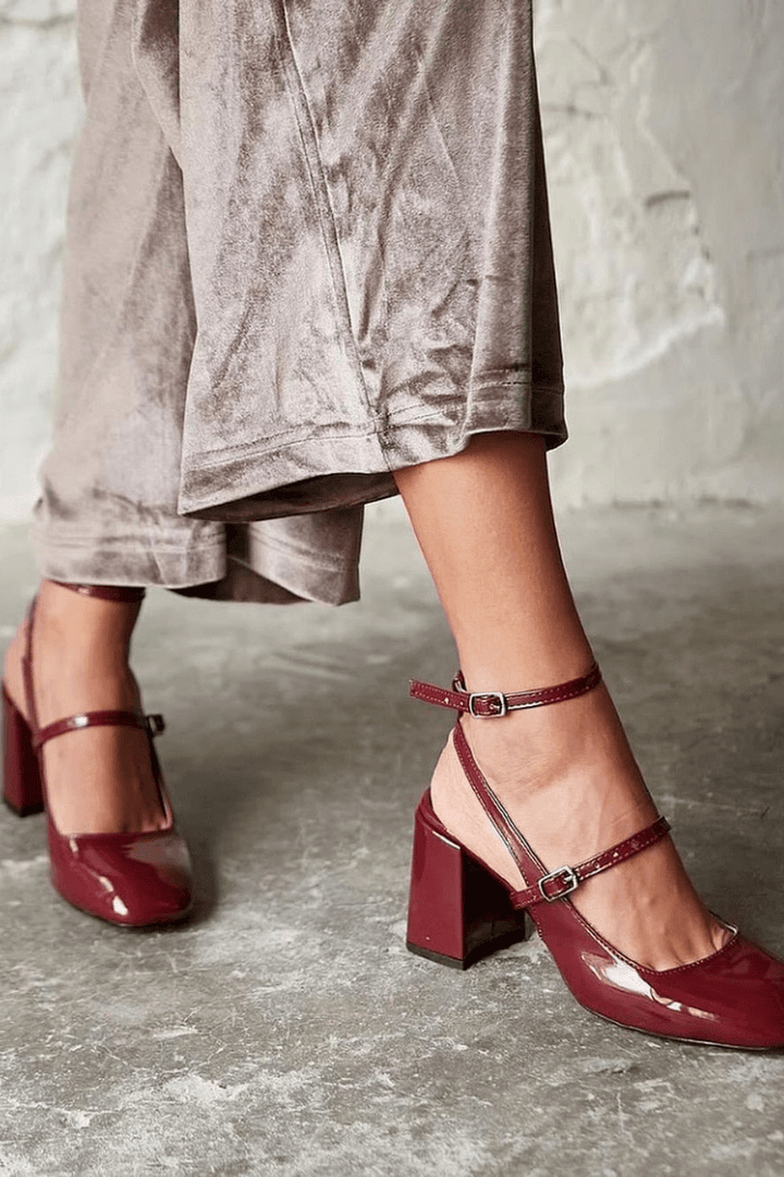 Glossy burgundy Mary Jane pumps with double ankle straps and chunky block heels