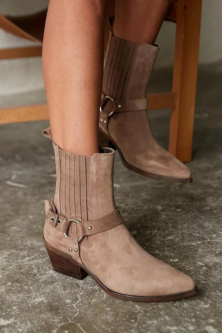Brown women's western ankle boots with pointed toes, buckle straps and chunky block heels