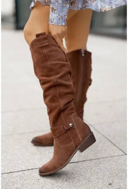 Women's over-the-knee slouch boots with low heels, side zips and buckle details