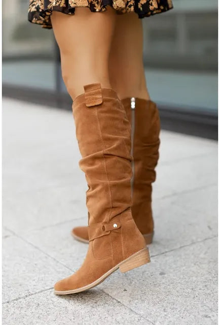 Women's over-the-knee slouch boots with low heels, side zips and buckle details
