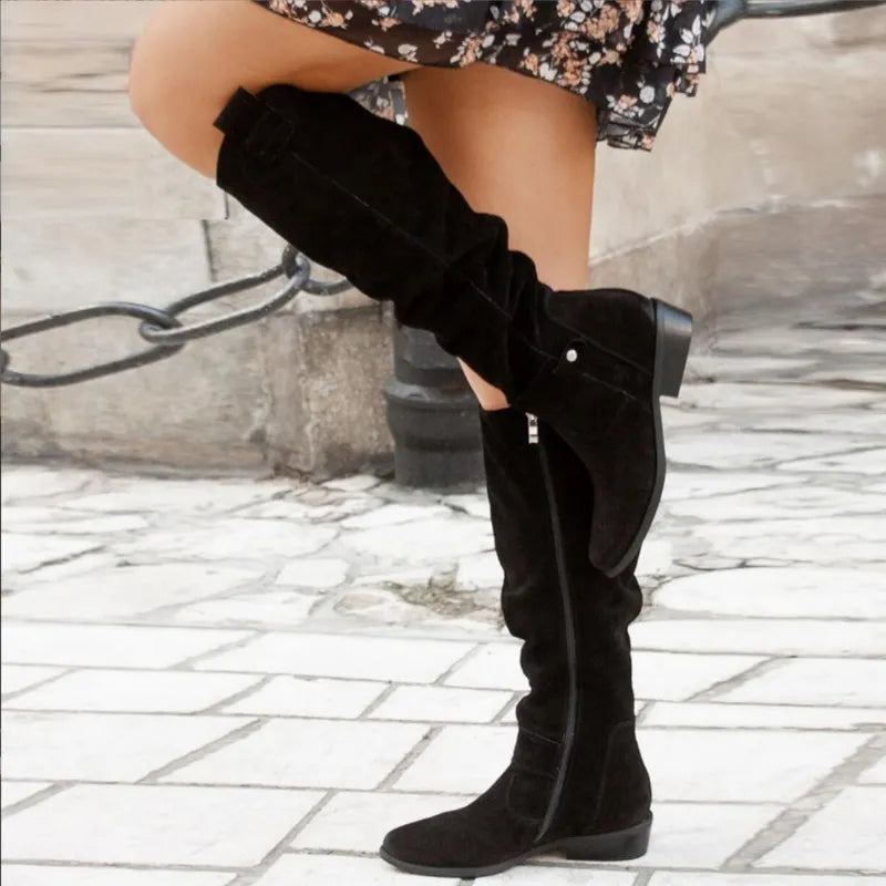 Women's over-the-knee slouch boots with low heels, side zips and buckle details