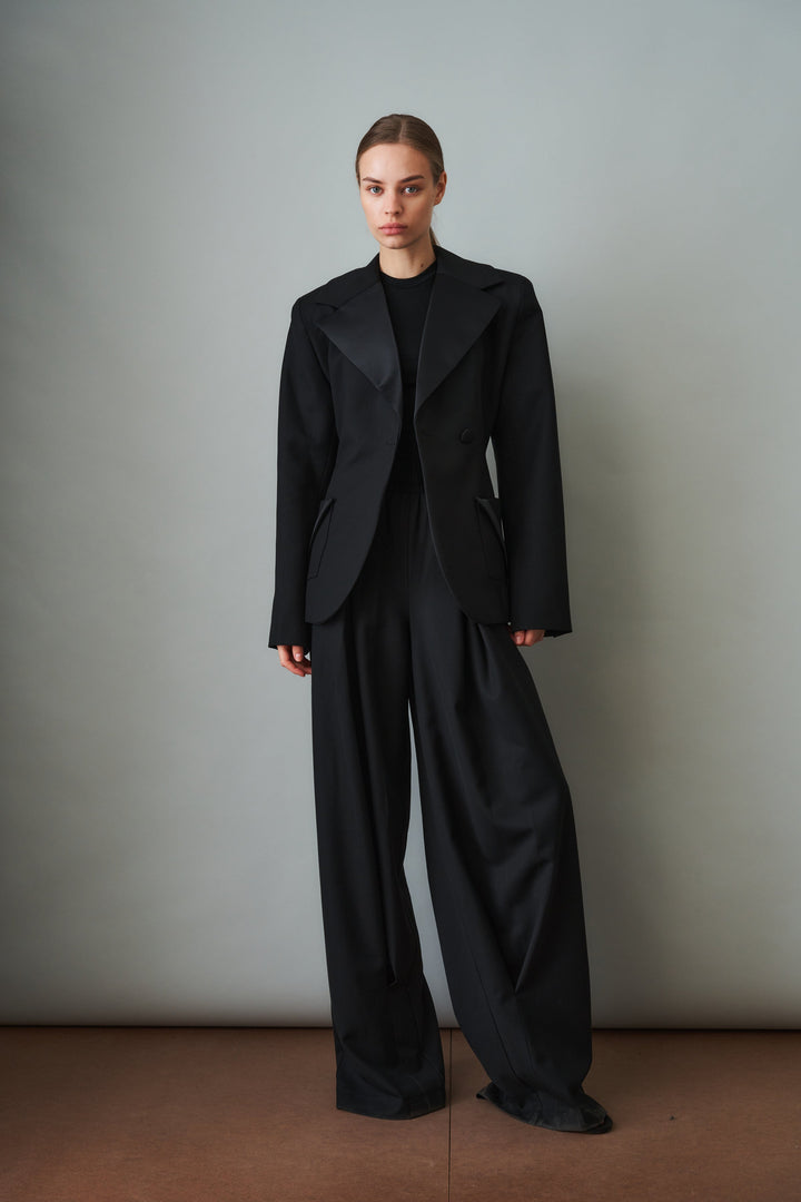 Women's black sculpted blazer with notched lapels and flap pockets