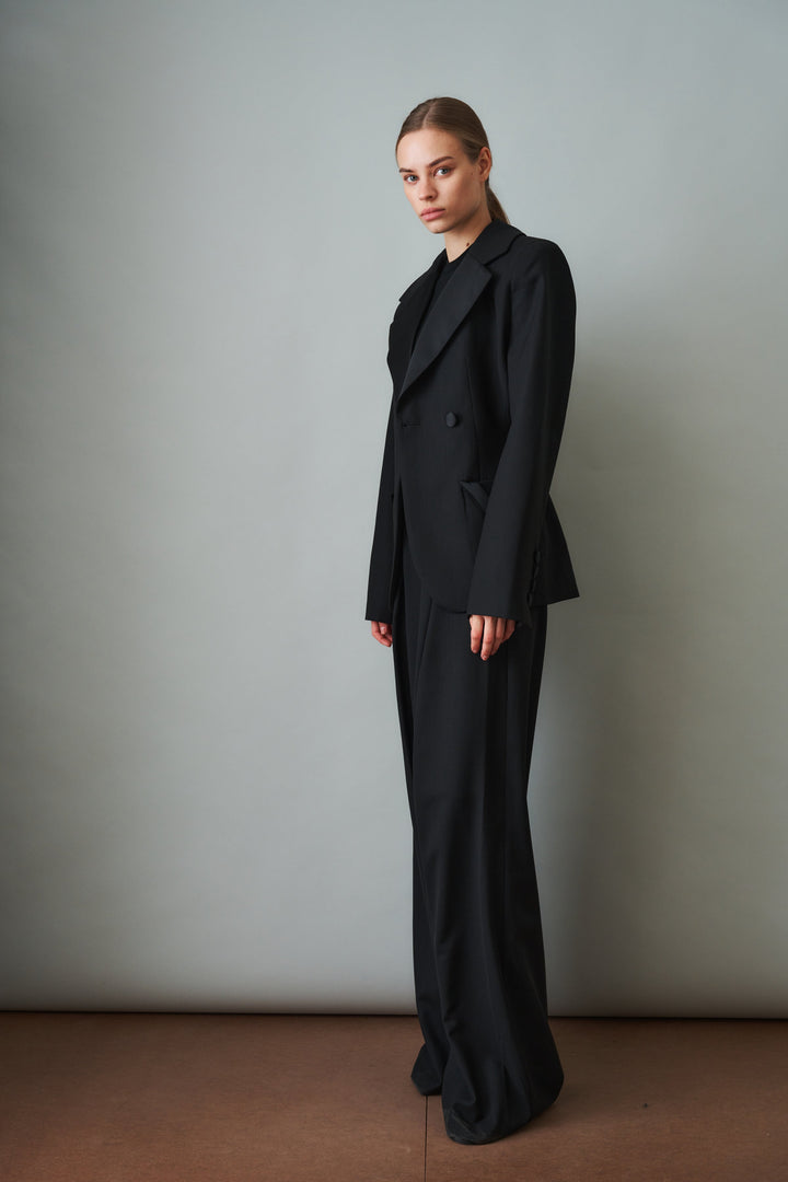 Women's black sculpted blazer with notched lapels and flap pockets