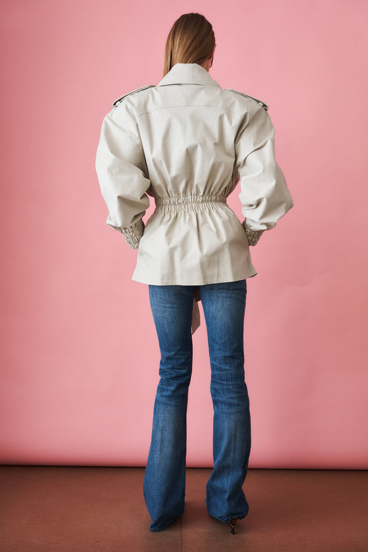 Women's beige trench coat with tie waist, wide collar and long sleeves