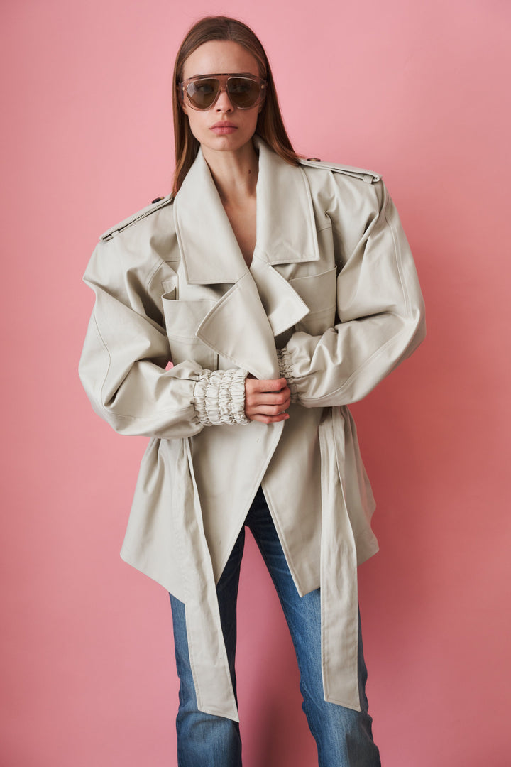 Women's beige trench coat with tie waist, wide collar and long sleeves