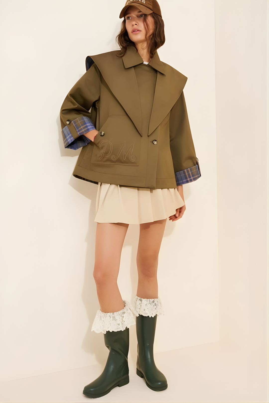 Women's brown jacket with blue plaid trim, raised collar and button front