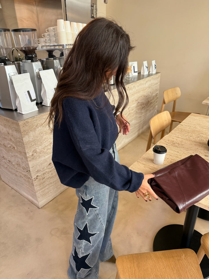 Women's light blue wide leg jeans with dark star details