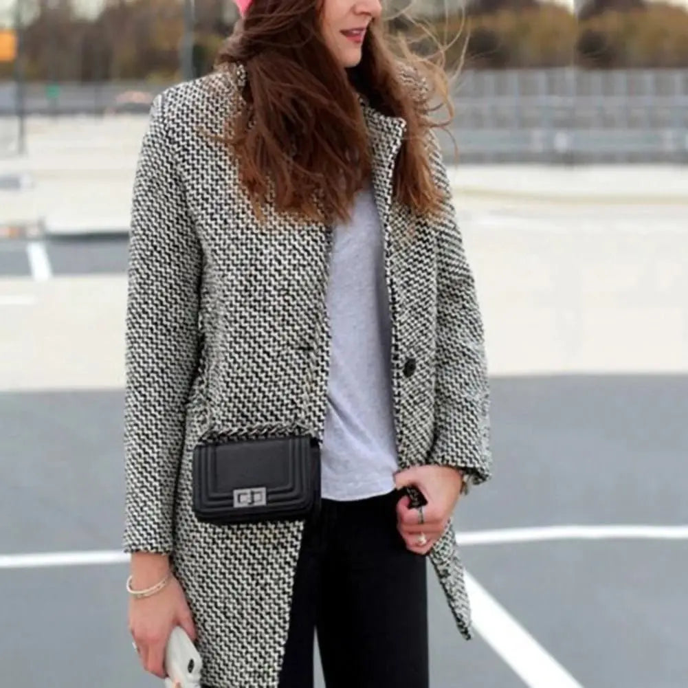 Women's long black and white houndstooth coat with lapels and button front