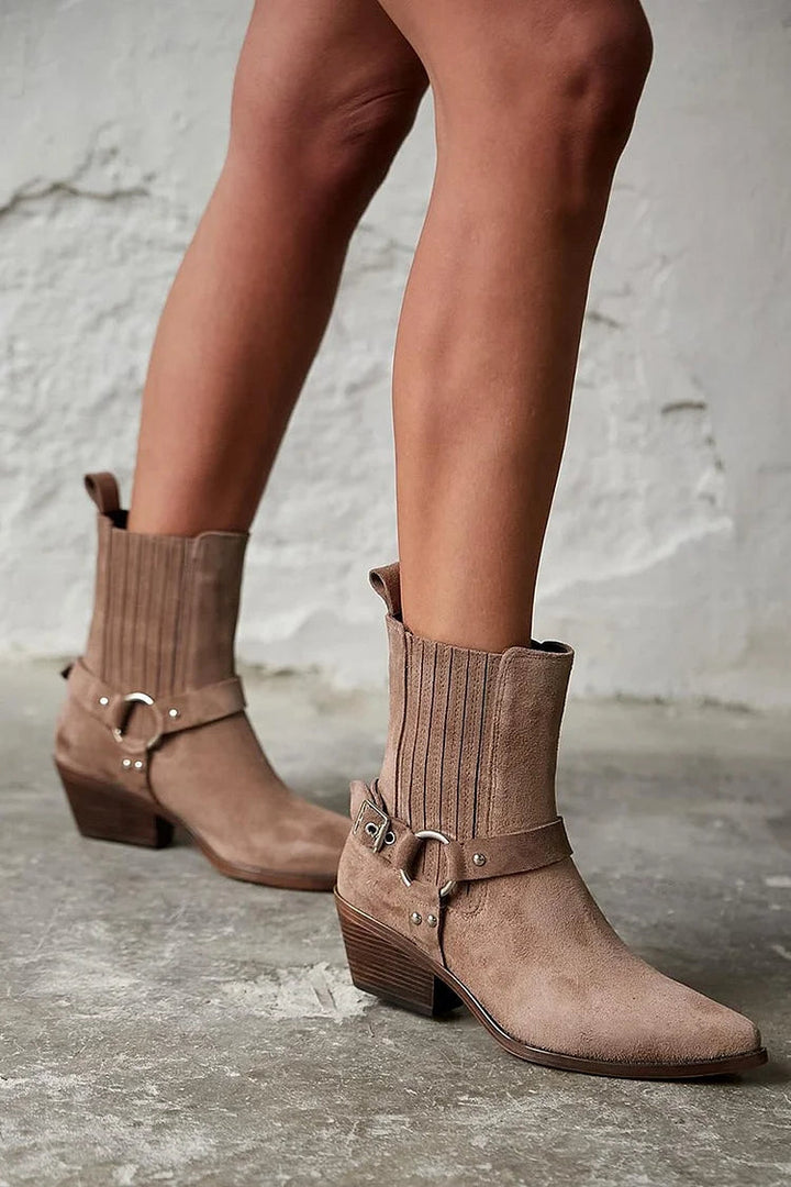 Brown women's western ankle boots with pointed toes, buckle straps and chunky block heels