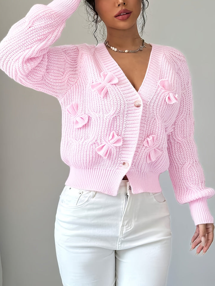 Women's ribbed knit cardigan with bow details, V-neckline and long sleeves