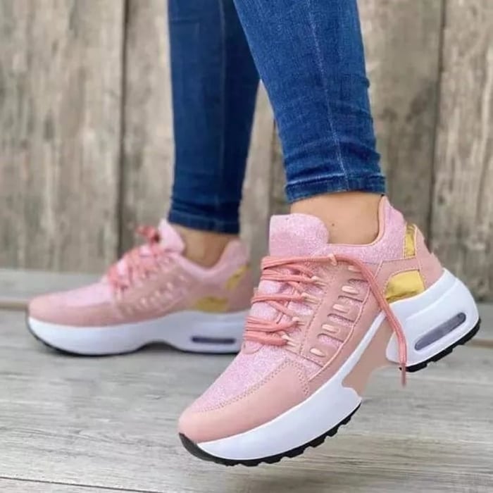 Women's low-top lace-up sneakers with layered panels and chunky sculpted soles