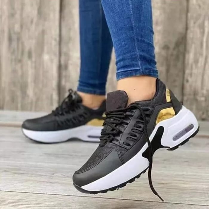Women's low-top lace-up sneakers with layered panels and chunky sculpted soles