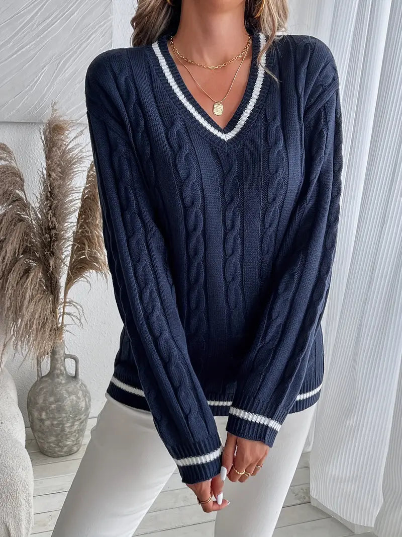Women's navy cable knit V-neck sweater with white striped trim