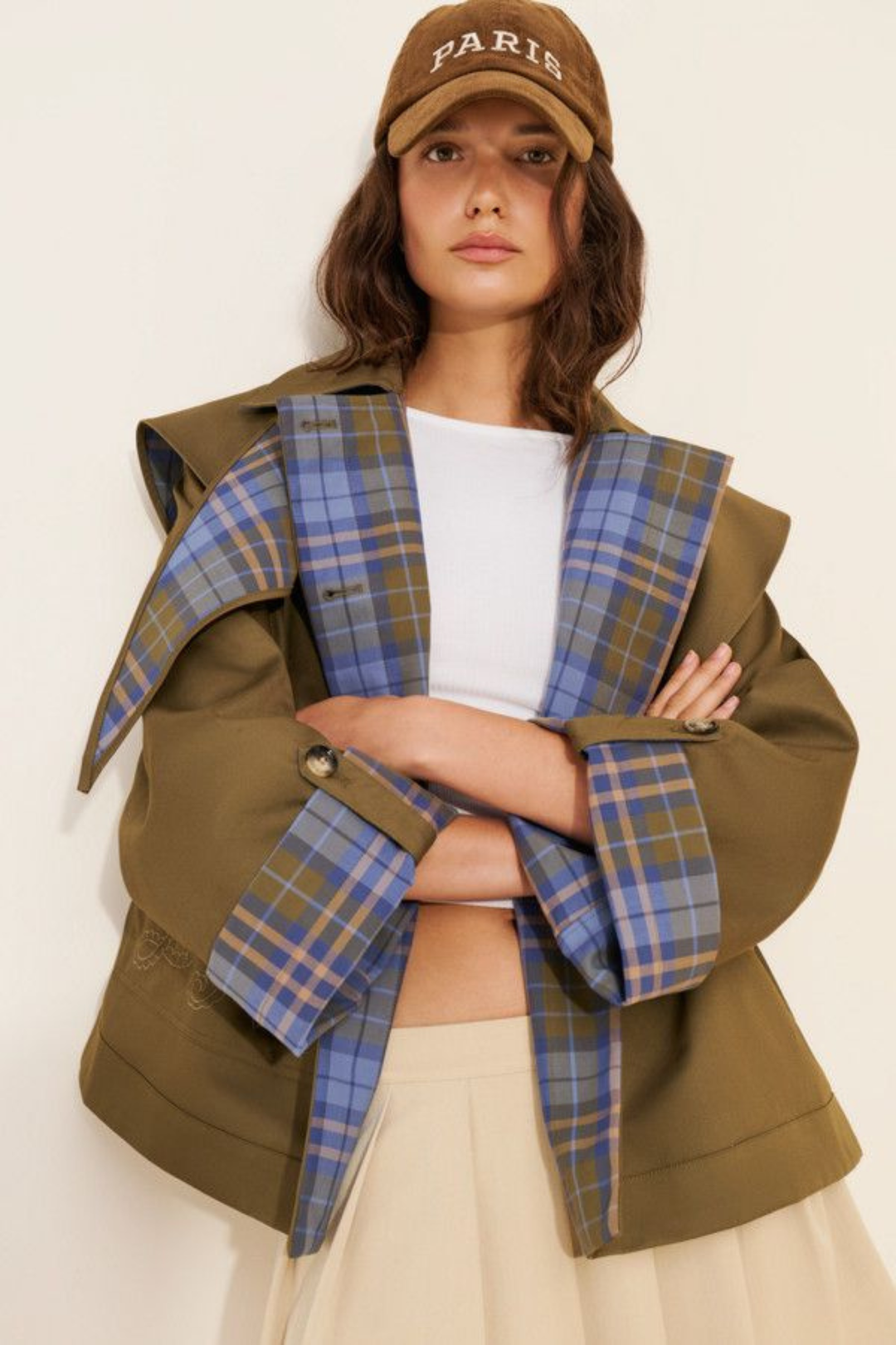 Women's brown jacket with blue plaid trim, raised collar and button front