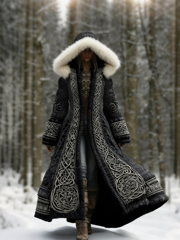 Women's hooded longline coat with ornate embroidery and pale hood trim