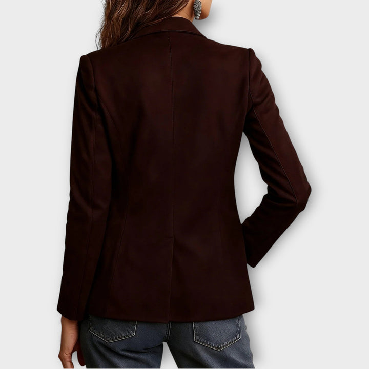 Women's vintage brown blazer with notched lapels, long sleeves, buttons and multiple pockets