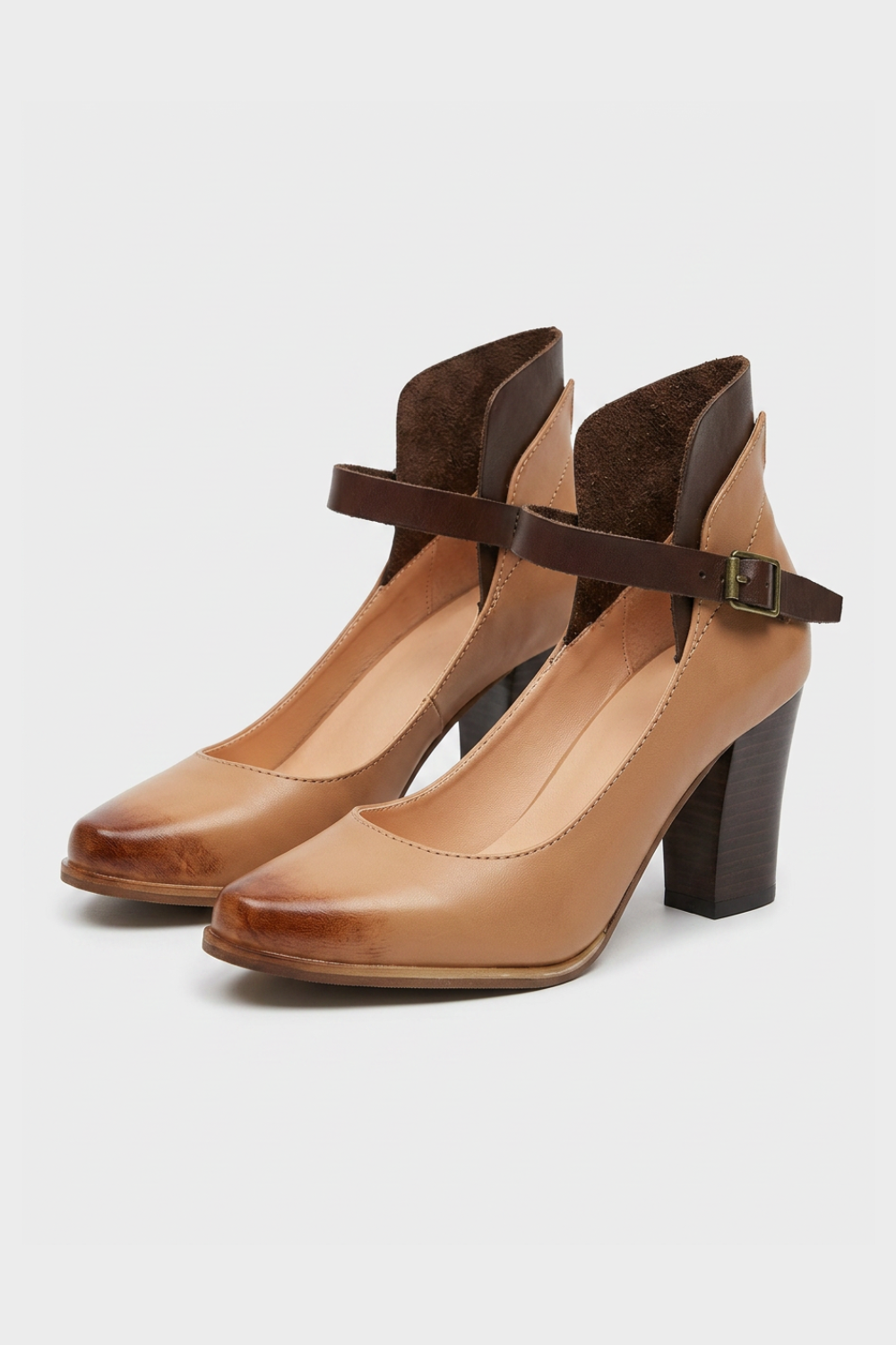 Women's closed-toe block heel pumps with ankle straps and buckle closures