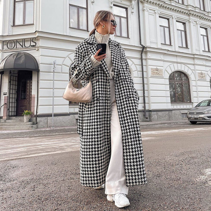 Women's black and white houndstooth long coat with lapel collar and button front