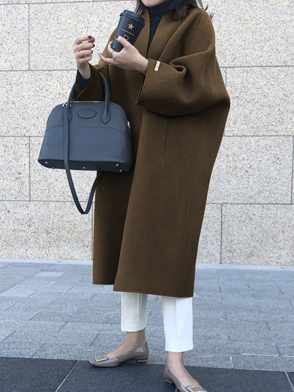 Women's collarless longline coat with open front and wide sleeves