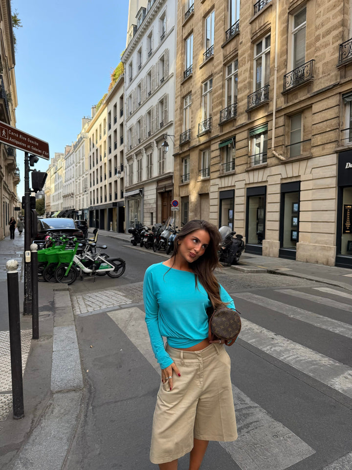 Women's blue asymmetric long sleeve top with off-shoulder neckline