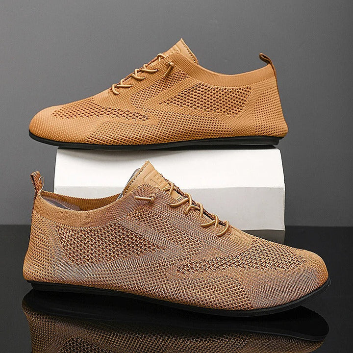 Knit lace-up shoes with round toes, flat soles and heel pull tabs
