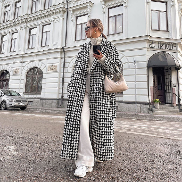 Women's black and white houndstooth long coat with lapel collar and button front