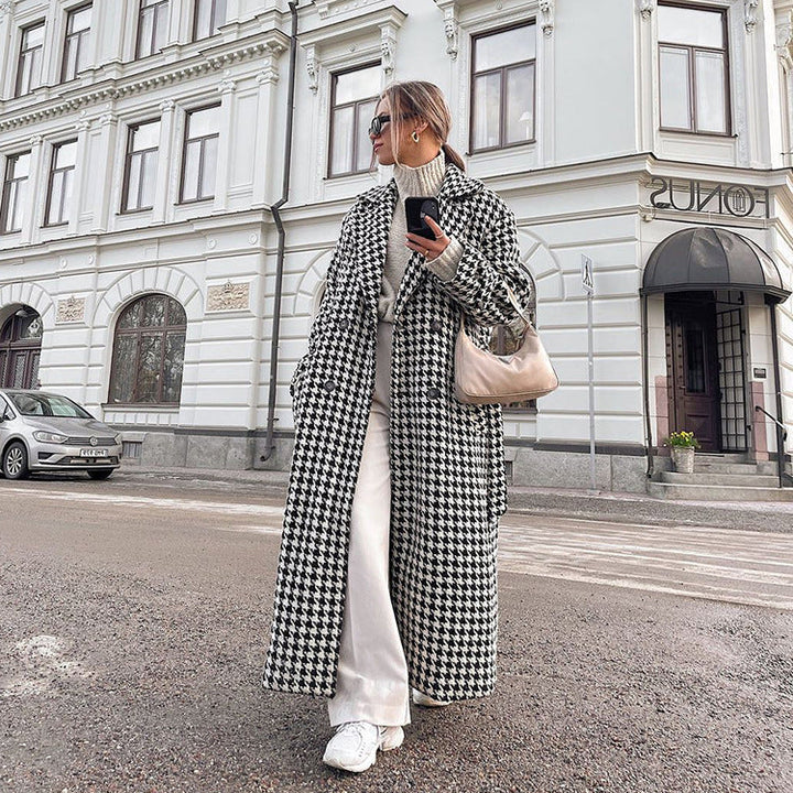 Women's black and white houndstooth long coat with lapel collar and button front